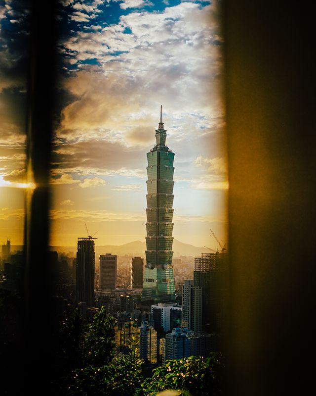 Taipei 101 seen through a window frame.