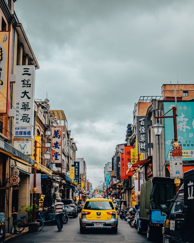 A yellow taxi on a Taipei street.