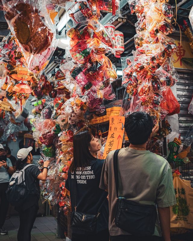Visitors gathered beneath rows of glowing lanterns.