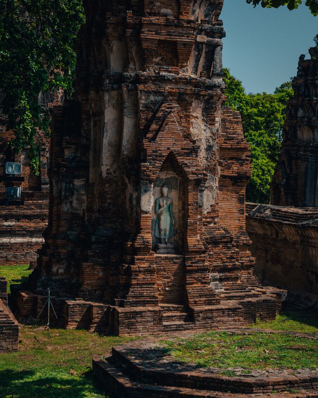 The ruins of a temple complex in the afternoon heat.