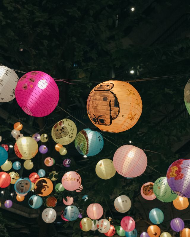 Colourful lanterns on display at a night market.