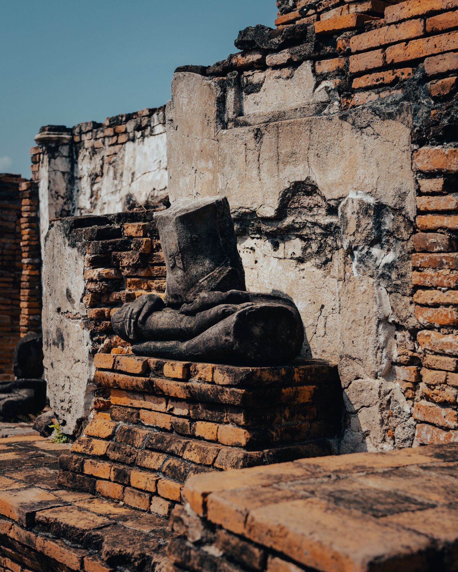 Ancient stone structures casting deep shadows.