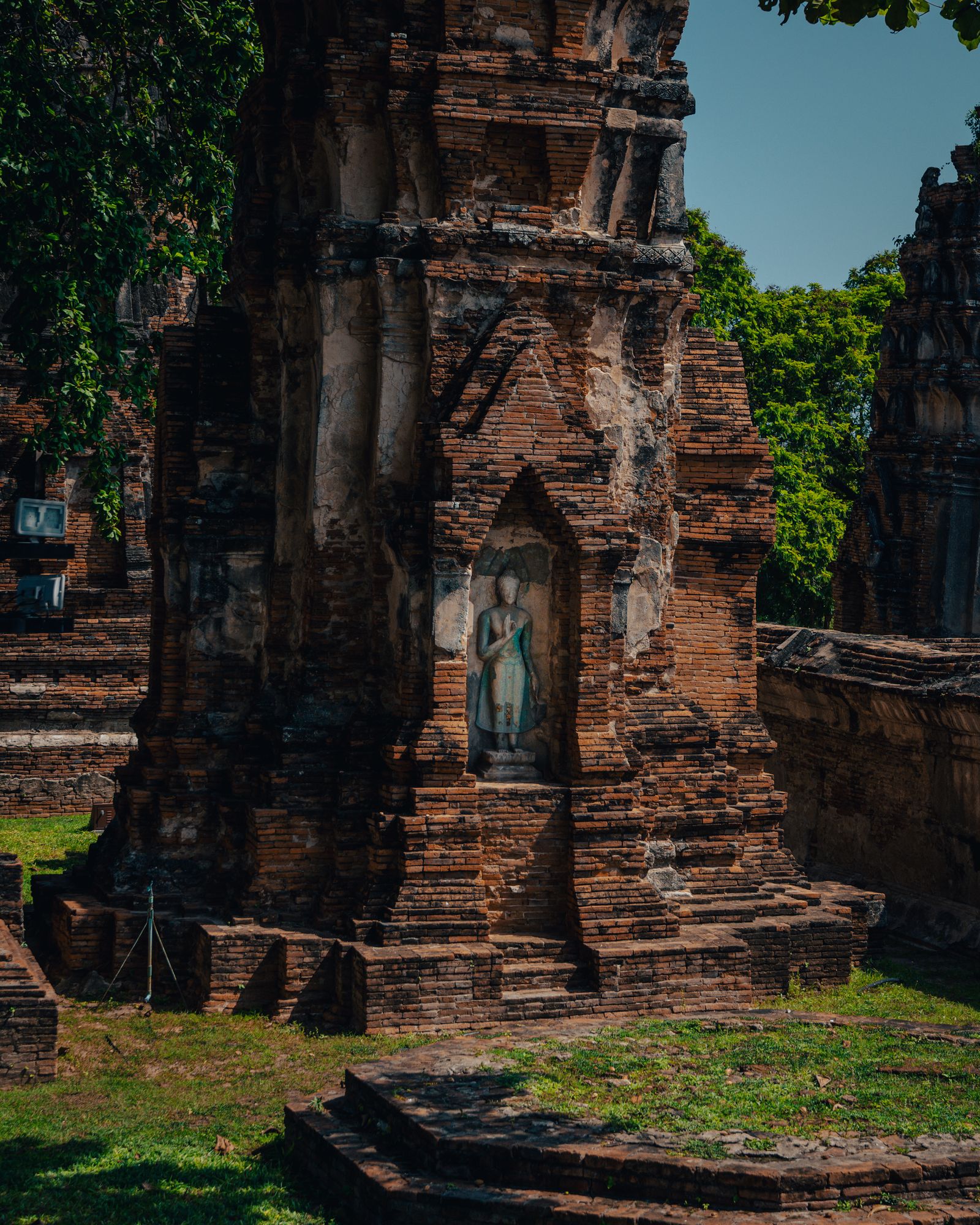 The ruins of a temple complex in the afternoon heat.