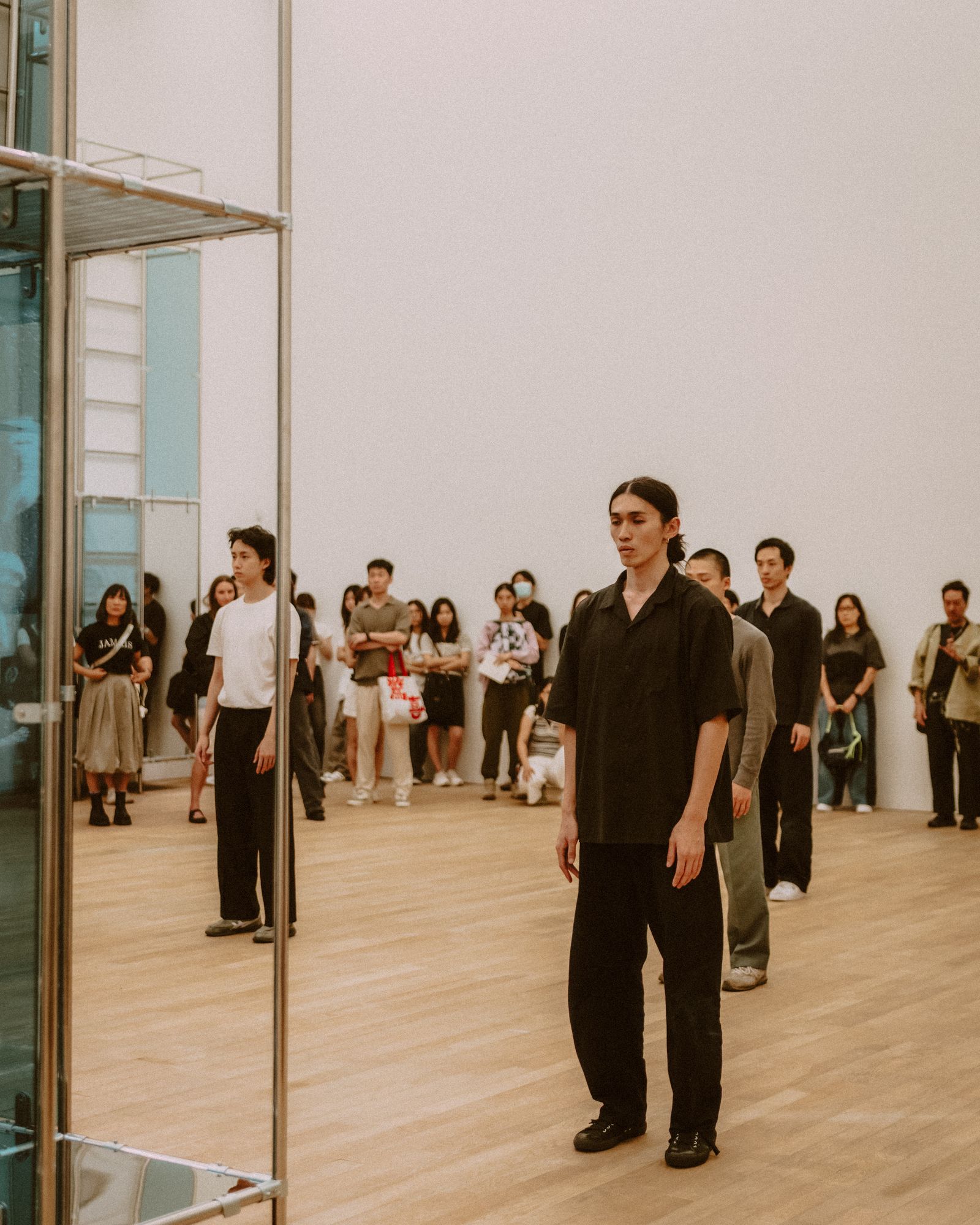 A group of dancers rehearsing in a studio.