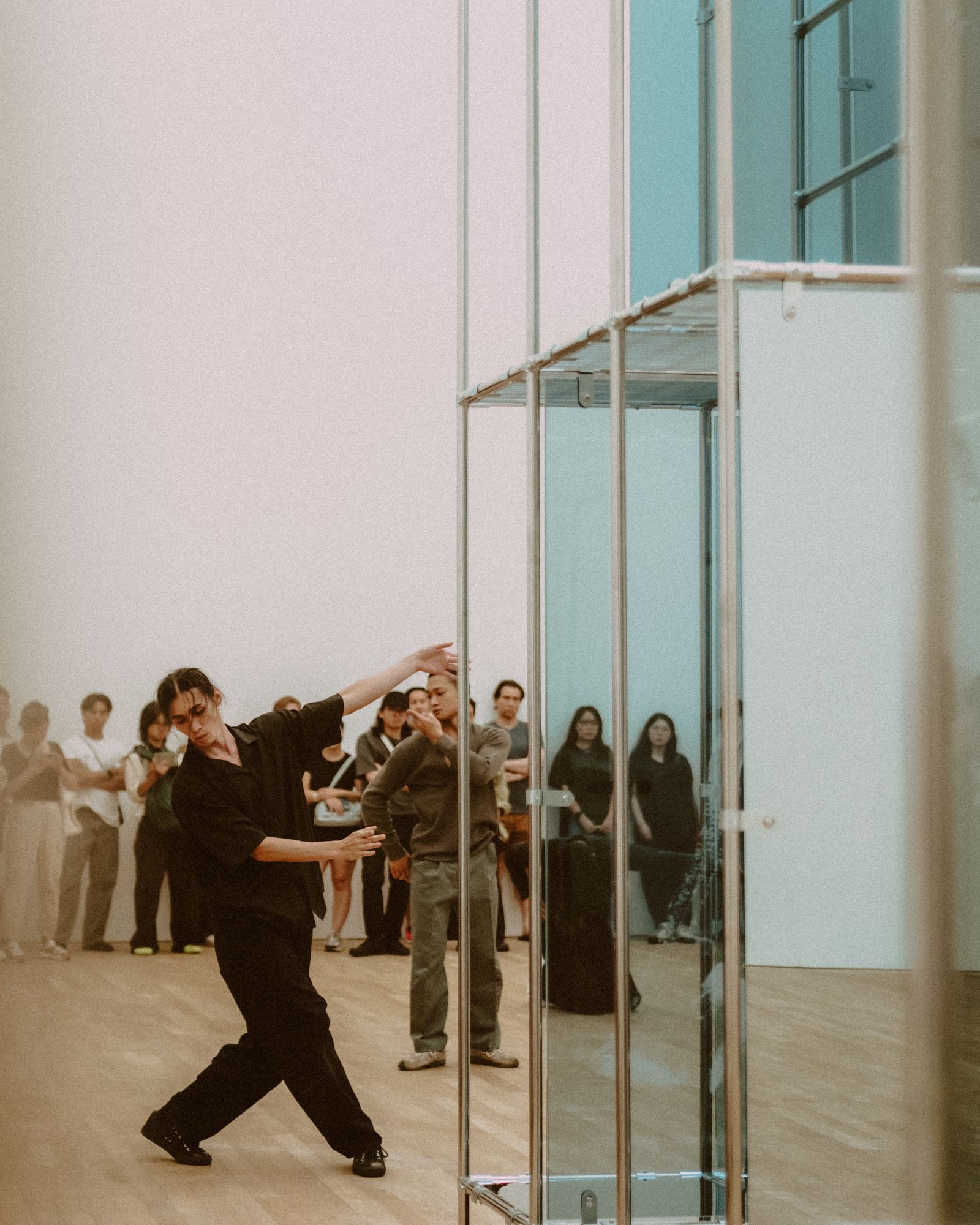 A dancer moving through a bright studio.