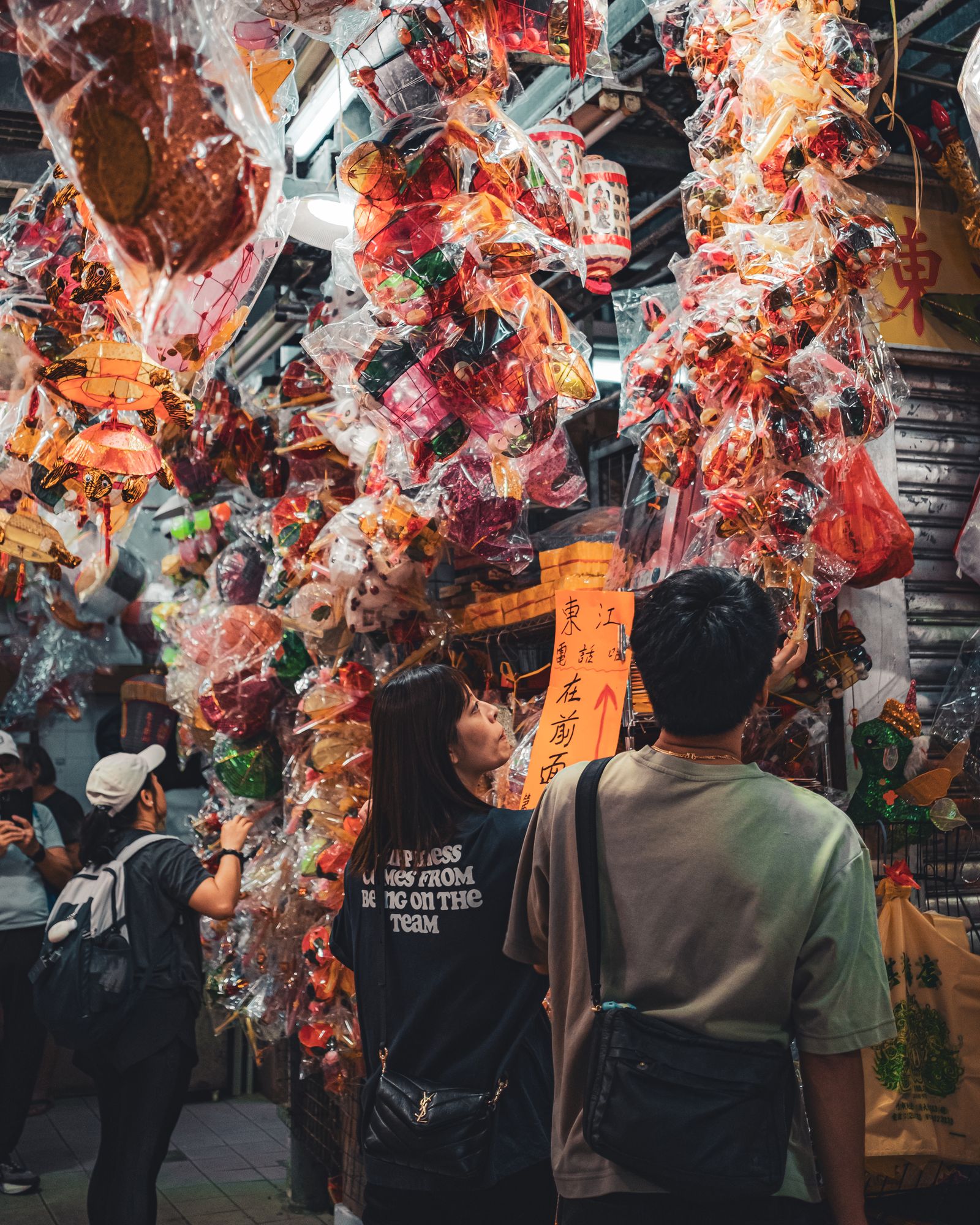 Visitors gathered beneath rows of glowing lanterns.